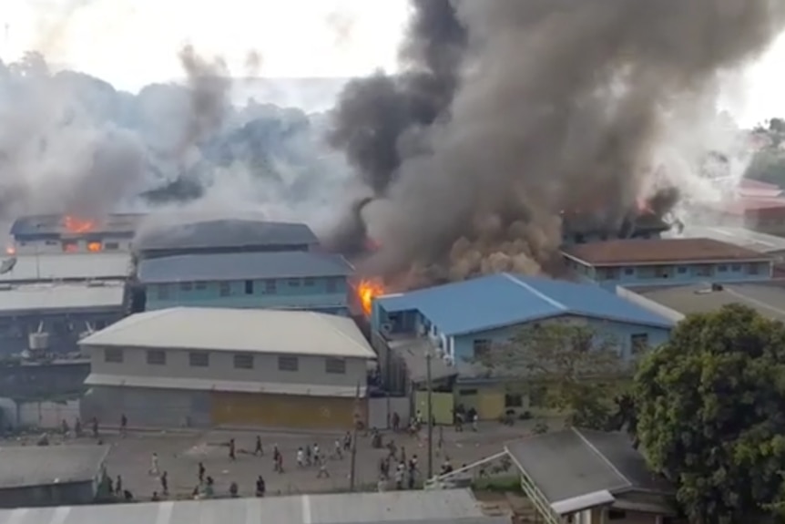 Smoke rises from burning buildings in Chinatown of Solomon Islands' capital Honiara.