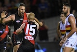 Cale Hooker (L) reacts after kicking a goal to put Essendon in front against Adelaide at Docklands.