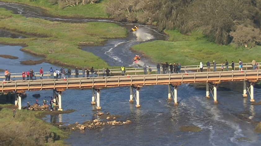 Aerial of spectators on bridge watching jet boats in 2014 Avon Descent