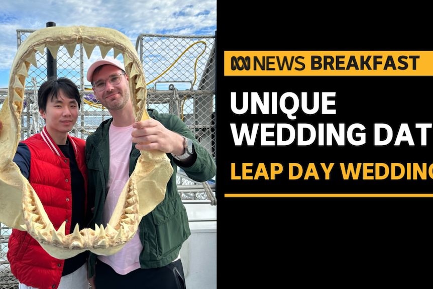 Unique Wedding Date, Leap Day Wedding: Two men hold up the skeletal jaw of a shark 