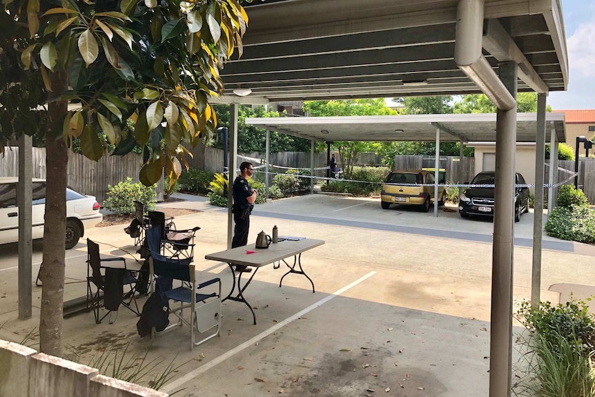 Policeman stands guard at Yeronga crime scene