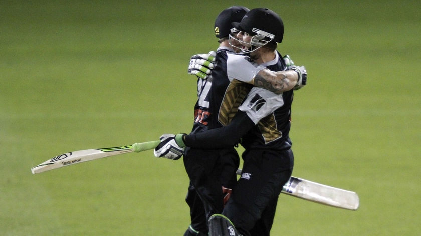 Winning embrace: Brendon McCullum and Martin Guptill celebrate New Zealand's stunning win.