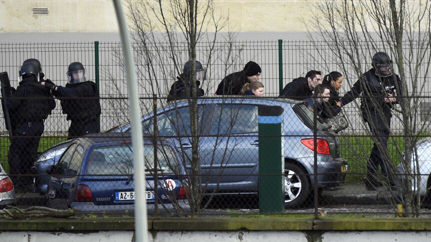 French police special forces evacuate local residents