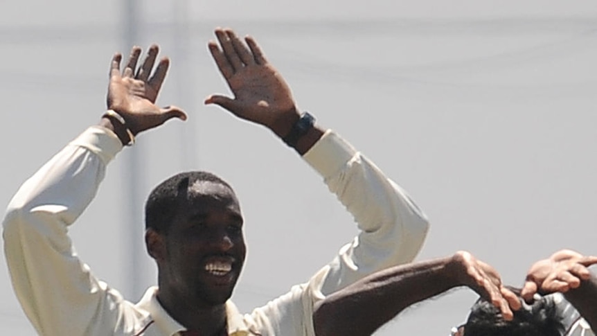 Under scrutiny ... Shane Shillingford (second left) took four wickets in the first Test against Sri Lanka.