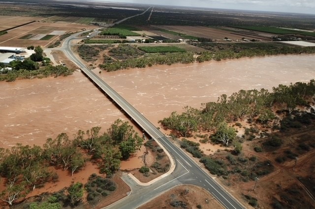 Road with flowing river below it