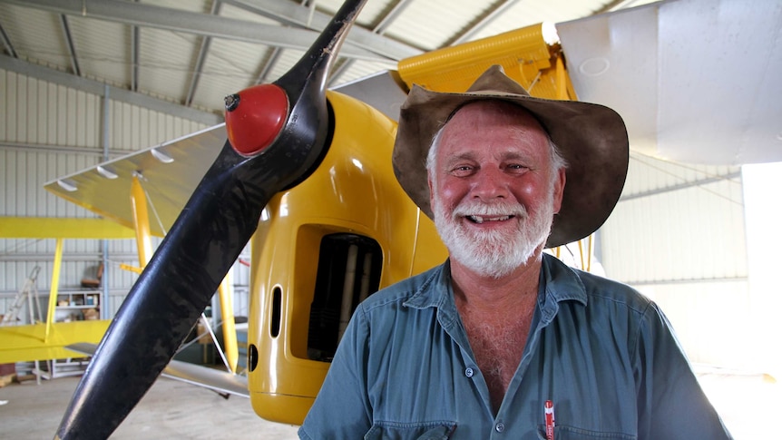 Ross Smith stands in front of restored plane in Rolleston workshop, April 2016.