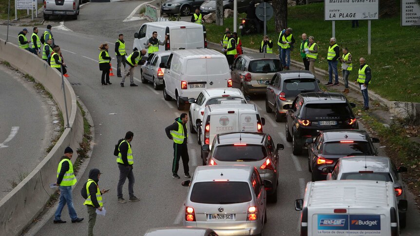 Demonstrators block a motorway exit to protest fuel tax in Marseille