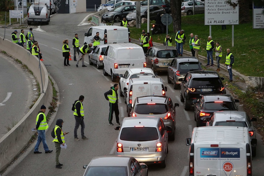 Demonstrators block a motorway exit to protest fuel tax in Marseille