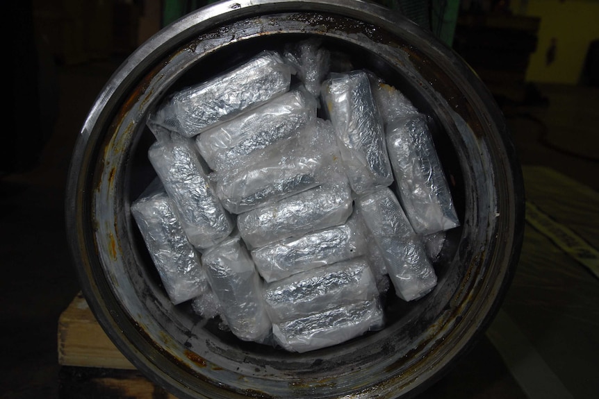 Packages can be seen stuffed inside a cylinder.