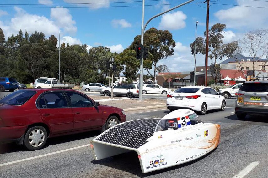 Nuon solar car in traffic in suburban Adelaide.