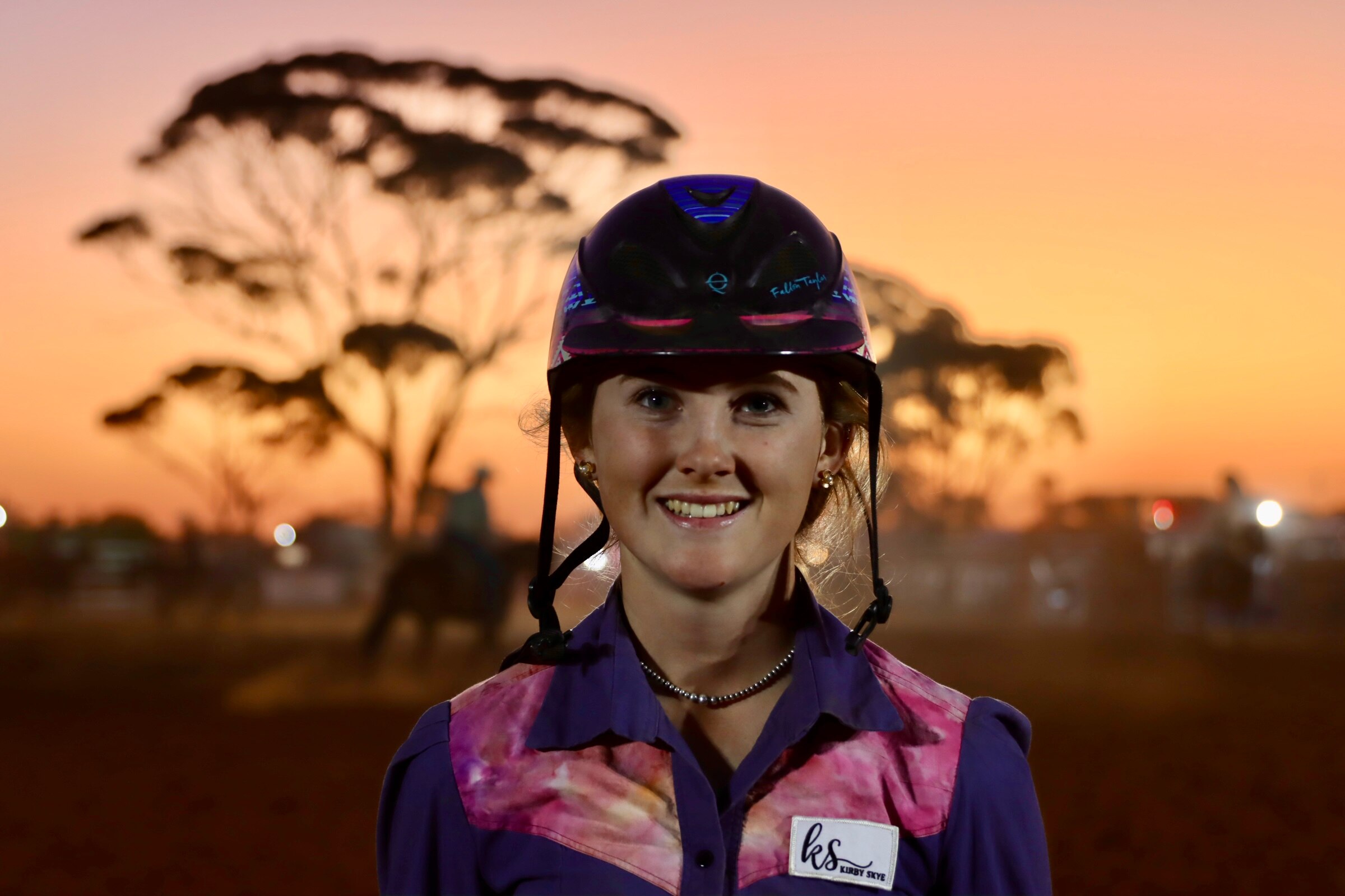 portrait of blonde teenager in a rodeo arena