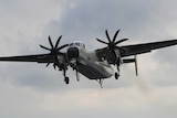 US Navy C-2 Greyhound takes off.