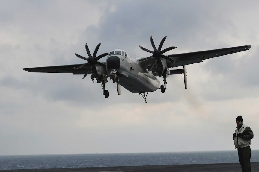 US Navy C-2 Greyhound takes off.