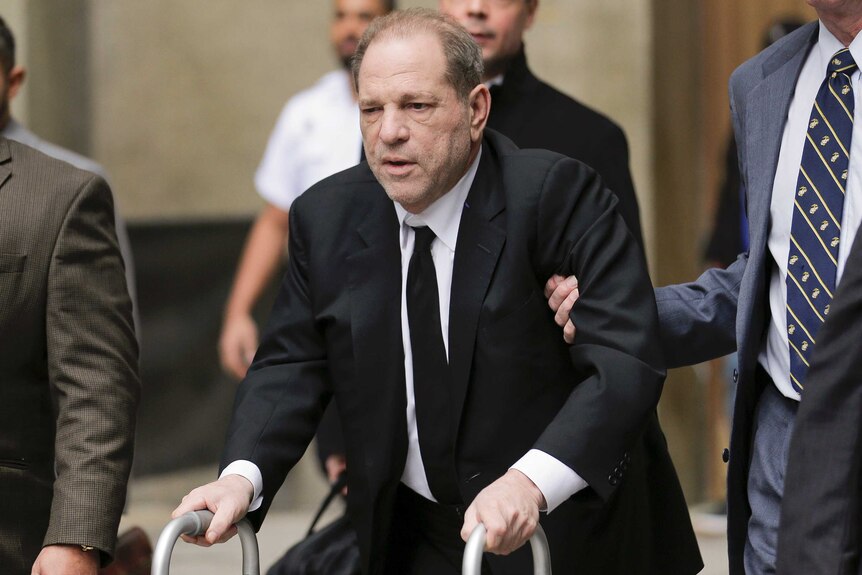Harvey Weinstein leaves New York court with a walker.