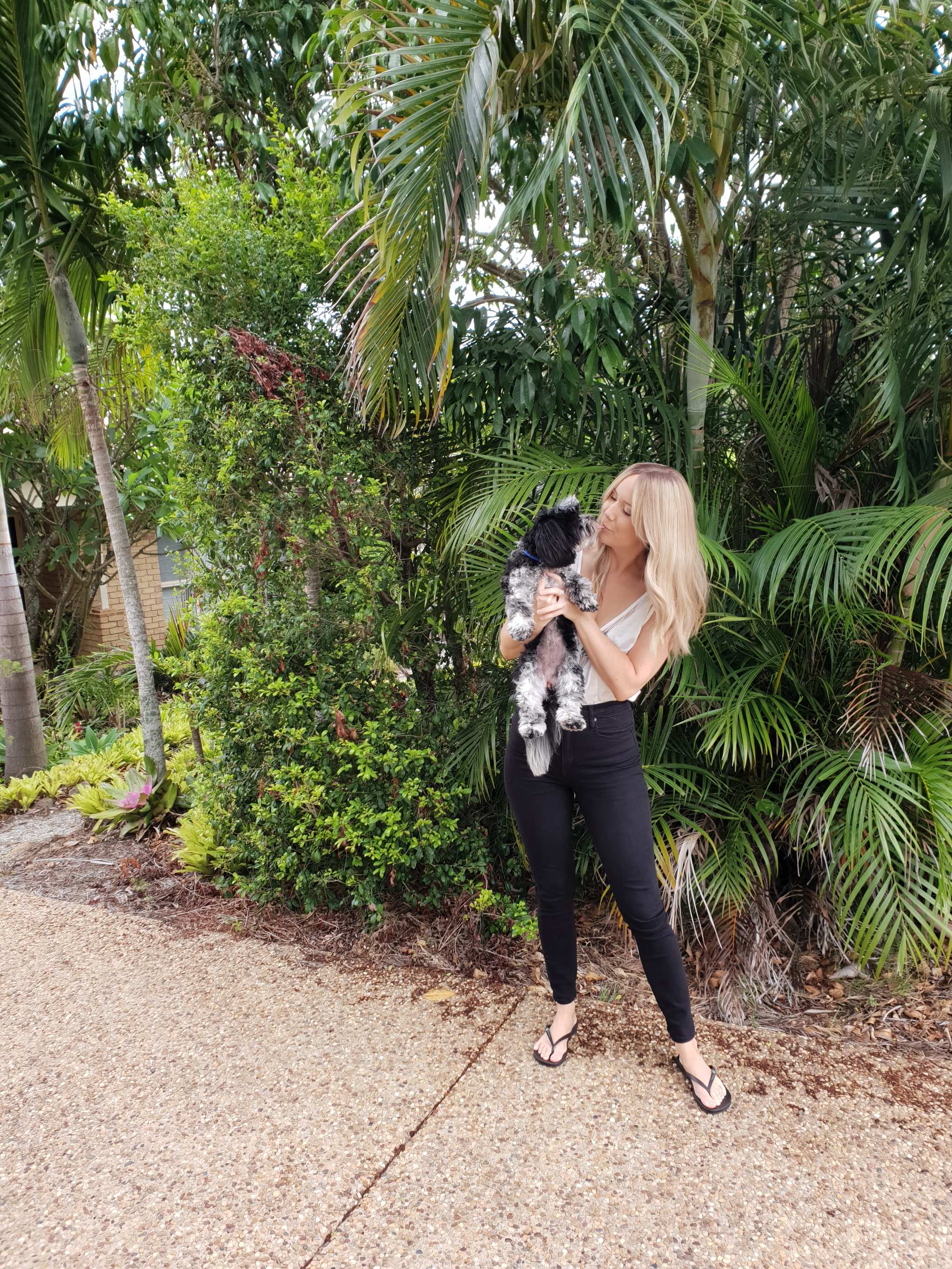 Kellie Scott holding her dog Peppa
