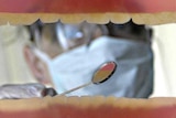 A blurry shot of a dentist.