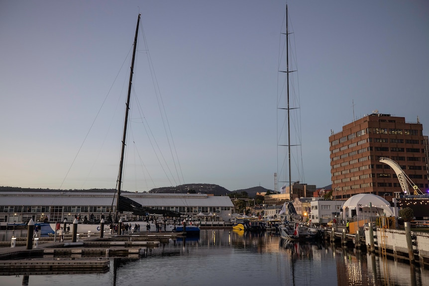 Two supermaxi yachts in a Hobart dock.
