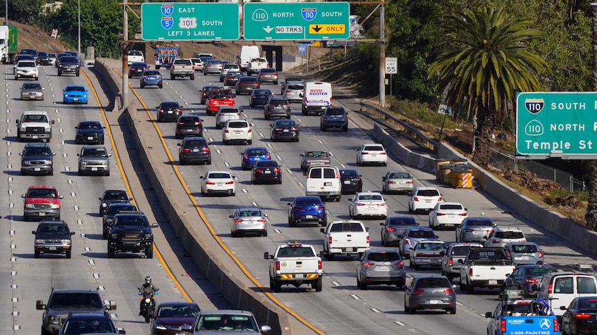 Cars are shown on a busy freeway