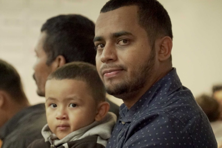 A man and child in McAllen, Texas, near the Mexican border.