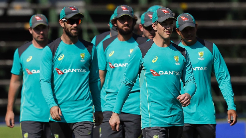 Australia's captain Tim Paine (front), walks with teammates in Johannesburg on March 29, 2018.