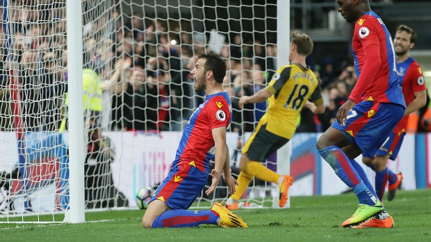 Crystal Palace's Luka Milivokjevic (L) celebrates after scoring a penalty against Arsenal.
