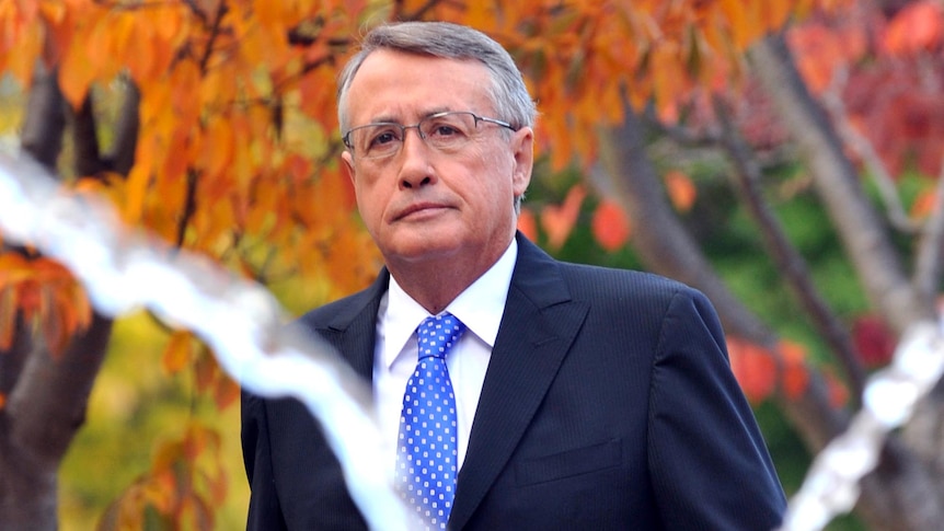 Treasurer Wayne Swan arrives at Parliament House in Canberra.