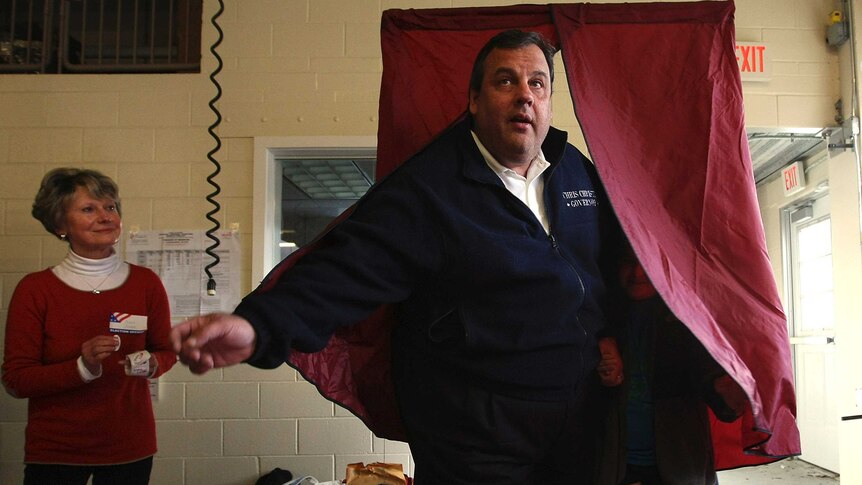New Jersey governor Chris Christie exits a voting booth