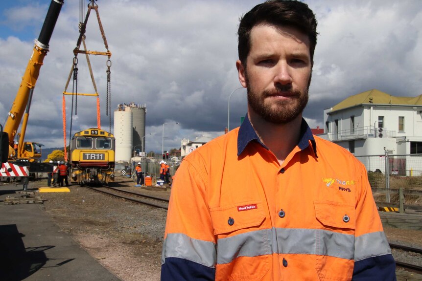 Rhys Prestidge, TasRail general manager of asset management, at the site of the derailed locomotive.