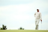 In the hunt ... Tiger Woods waits on the eighth green