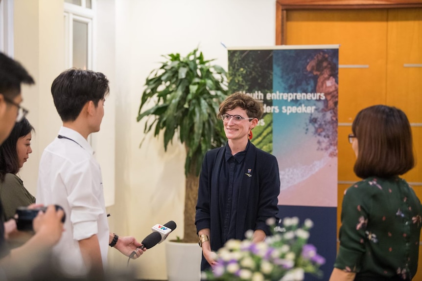 Dr Elise Stephenson, Google's Top 50 LGBTIQ+ Australian leaders, speaking to a person holding a microphone.