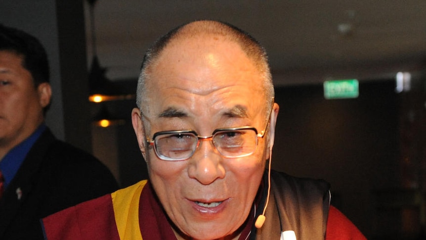 The Dalai Lama left the conference with a football under his arm