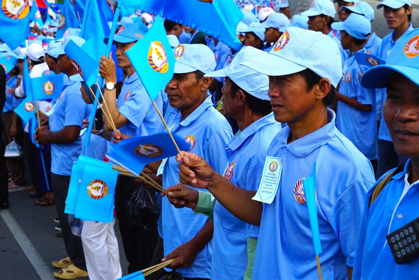 Supporters with flags at a rally for the Cambodian People's Party