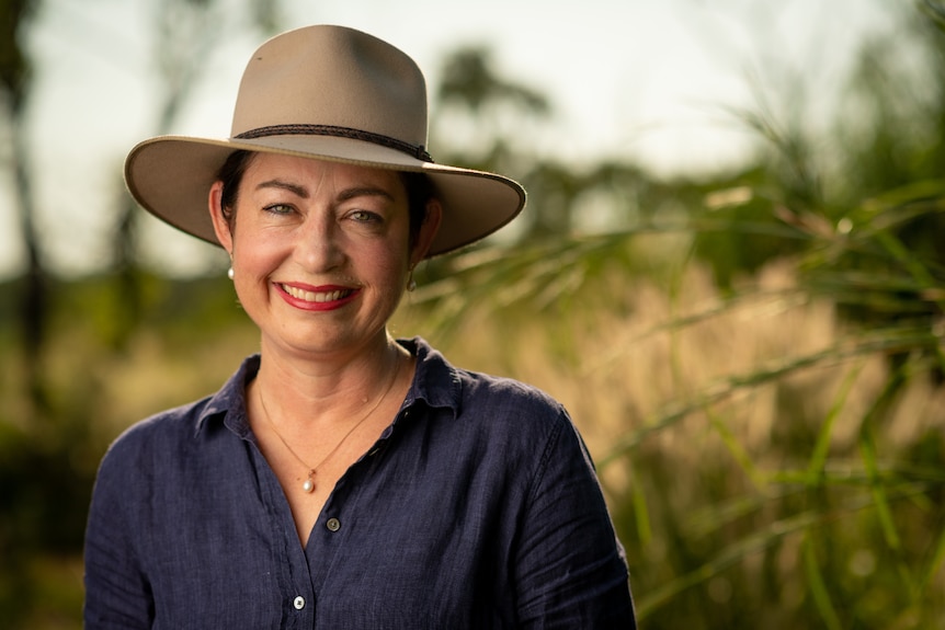 Shadow Minister for Environment and Water Terri Butler smiling at the camera and standing in a field on a sunny day.