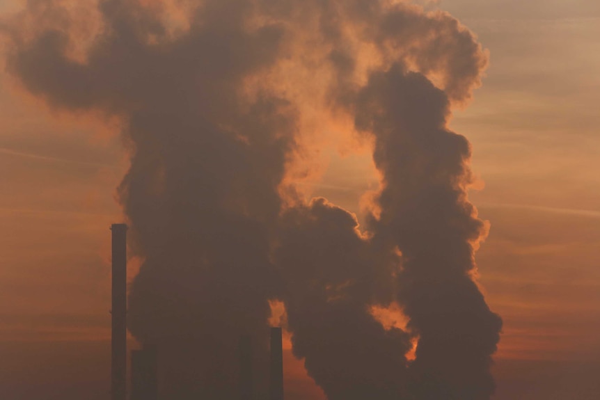 Smoke and steam coming from a power station.