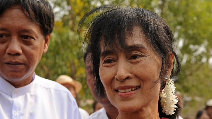 Aung San Suu Kyi says she and her party will swear the parliamentary oath.