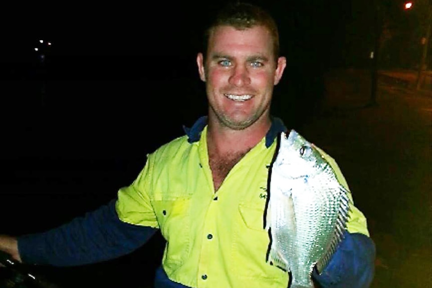 Missing fisherman Luke Howard holding a fish.