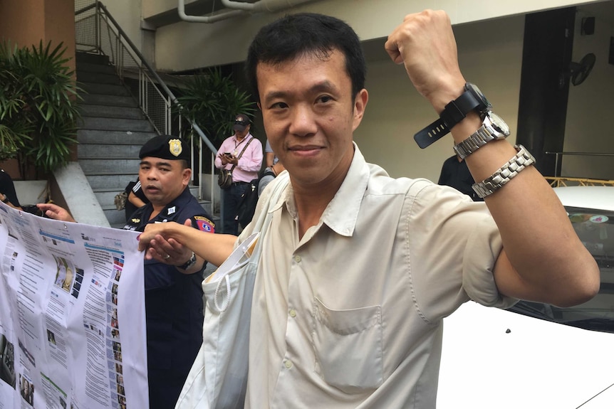 Ekachai Hongkangwan holds up his arm with three watches strapped to it.
