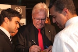Les Murray signs a football in Sydney