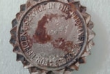 A military service medal with a number and the name "Pincott" inscribed