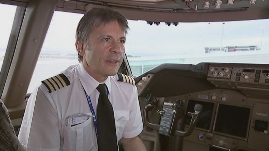 Bruce Dickinson wears a pilot's uniform as a professional courtesy