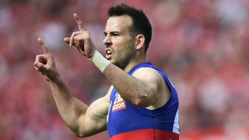Western Bulldogs Tory Dickson reacts after kicking a goal in the first quarter against Sydney.