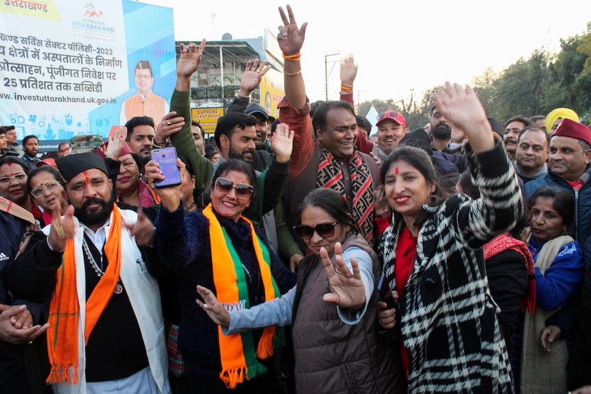 India's Bharatiya Janata Party supporters celebrate after Uttarakhand state lawmakers passed a new civil code.