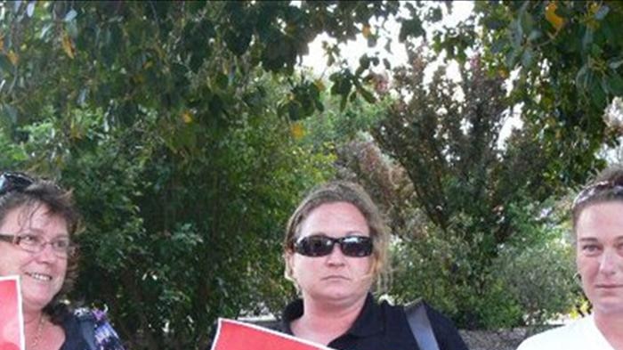 Protesters laid out "NO" signs in Northam