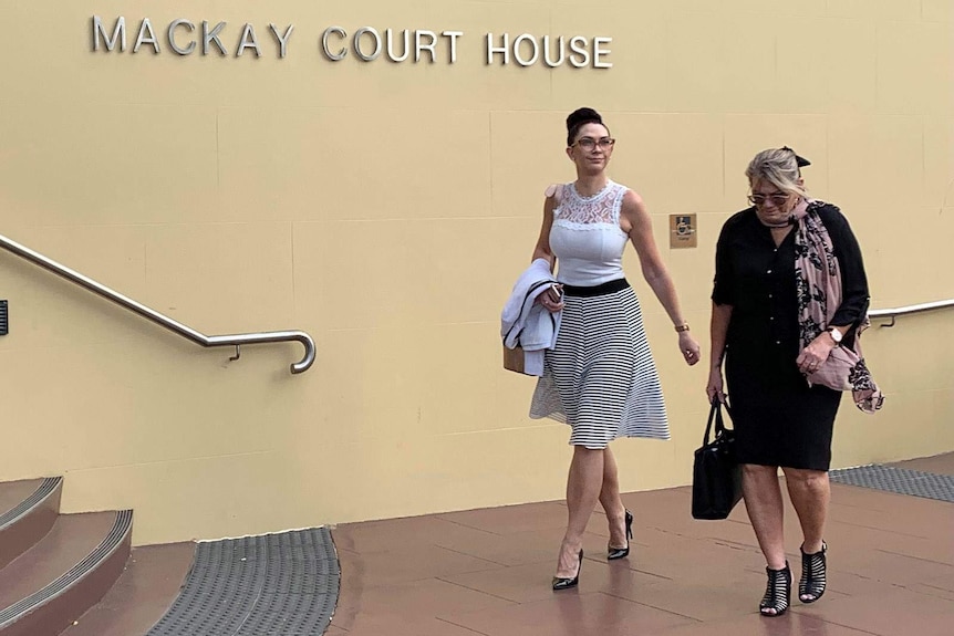 Two women entering a courthouse