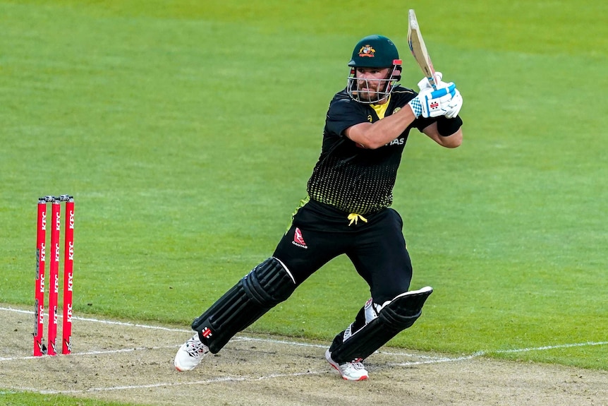 Aaron Finch watches a shot he made to the off side while batting for Australia against New Zealand.