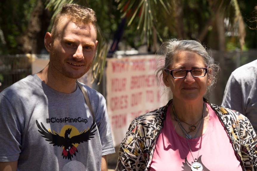 Andrew Paine and Margaret Pestorius outside look at the camera.