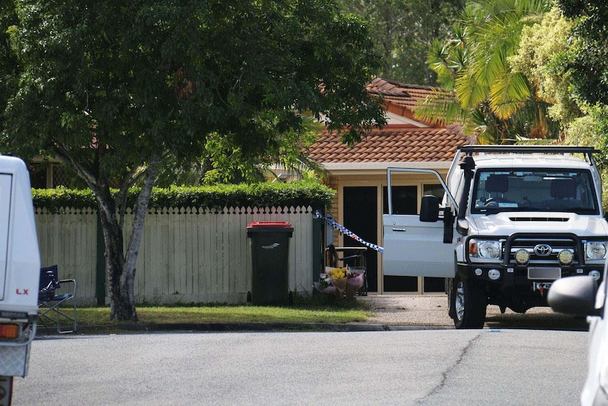 Police vehicles and crime scene tape at a home at Narangba, north of Brisbane.