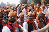 Crowd of BJP supporters at a political rally. 