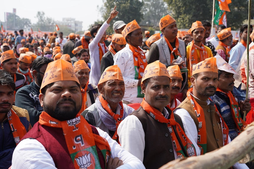 Crowd of BJP supporters at a political rally. 