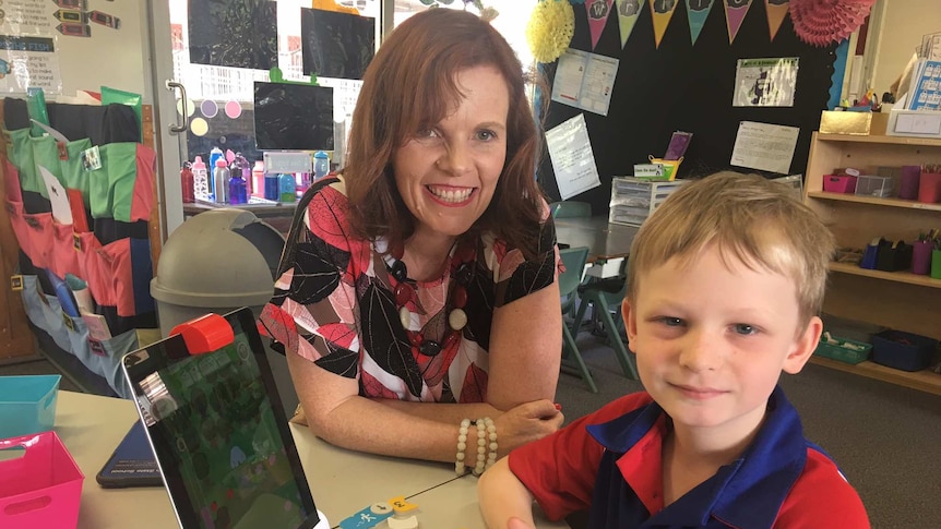 Oakleigh State School digital learning coordinator Nicola Flanagan with a student